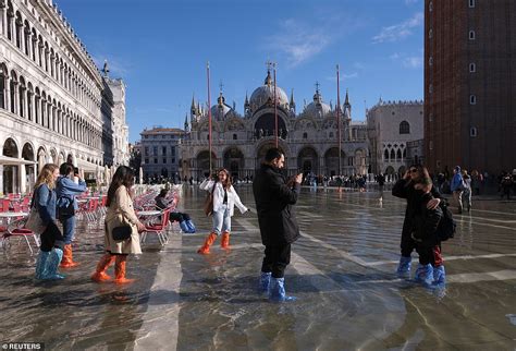 Tourists Wade Through Water In St Mark S Square After Venice Floods