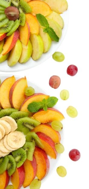 Premium Photo Assortment Of Sliced Fruits On Plates Isolated On White