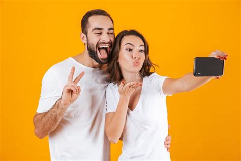 Portrait Of Two Excited People Man And Woman Taking Selfie Photo On