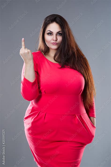 beautiful plus size fashion model in red dress fat woman with long hair showing fuck off sign