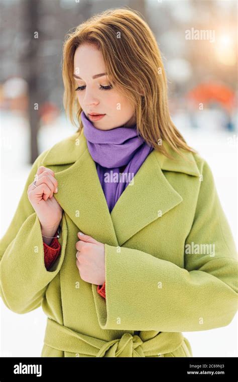Portrait Of Pretty Caucasian Woman Wearing Green Stylish Coat And