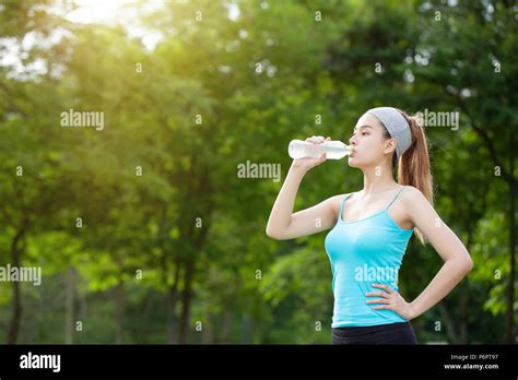 Girl Drinking Water Exercise Stock Photo Alamy