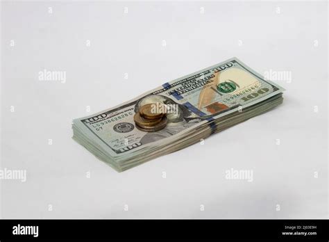 A Stack Of Hundred Dollar Bills On A White Isolated Background 100
