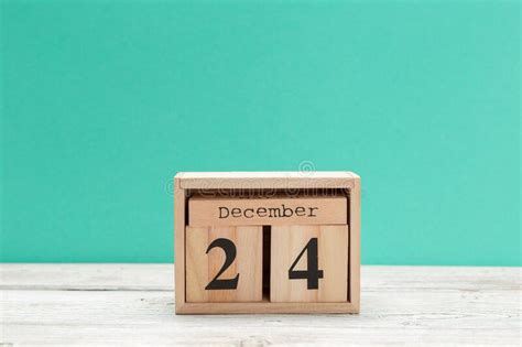 Wooden Cube Shape Calendar For December 24 On Wooden Tabletop Stock