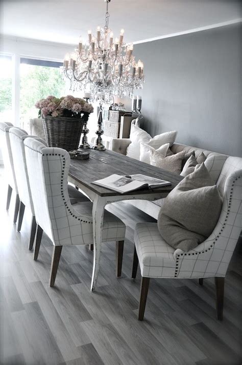 A dining table with benches provides for versatile seating since you can remove the furniture to another room and increase the seating space. Grey rustic dining table with beautiful fabric chairs. The combination is modern and elegant ...