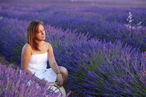 Woman Relaxing In The Field Of Lavender Stock Photo
