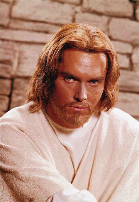 A Close Up Of A Person With Long Hair And A Beard Wearing A White Robe