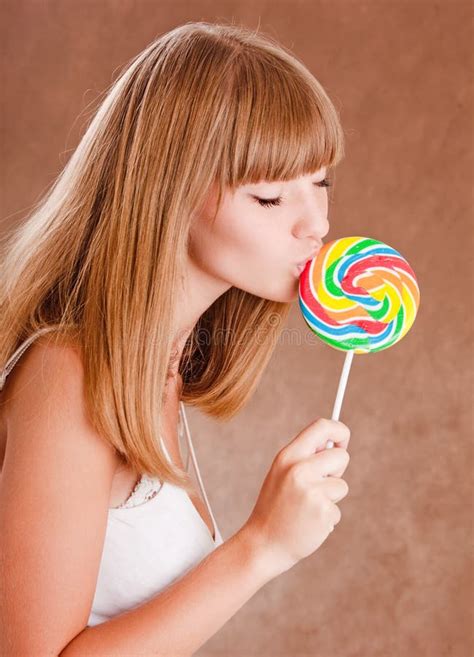 beautiful woman eating candy lollipop stock image image of makeup sensual 7065815