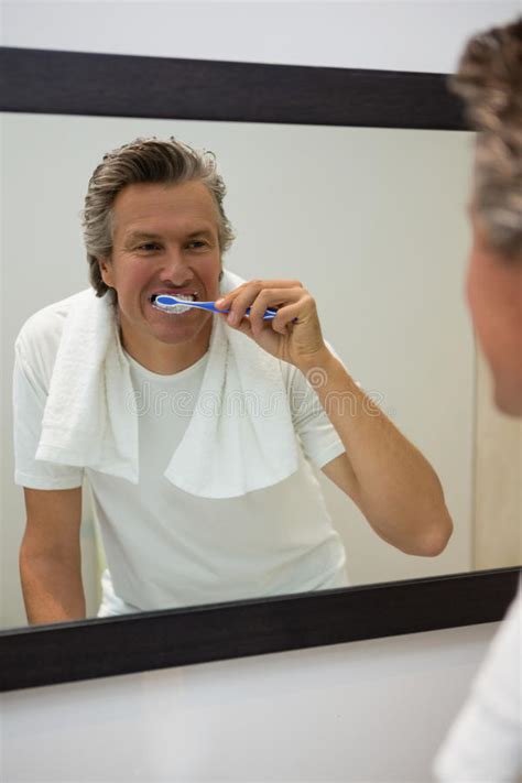 Man Brushing His Teeth In Bathroom Stock Image Image Of Activity