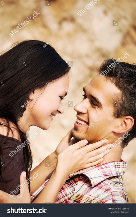 Beautiful Man And Woman Embracing In Nature Portrait