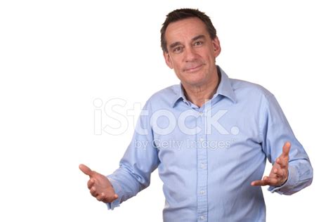 Smiling Business Man Using Hands To Explain Something Stock Photo