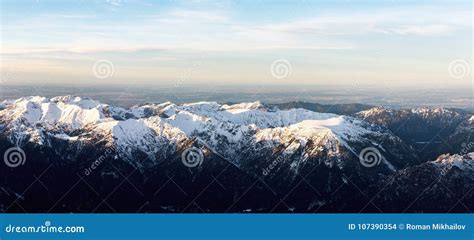 Aerial Panorama Of Snowy Mountain Tops In Sunset Stock Photo Image Of