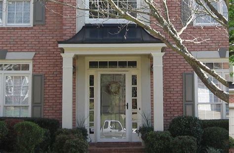 A Hip Roof Portico Features Downward Sloping Sides Blended With A