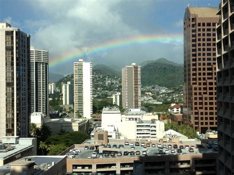 Rainbow Over City Buildings In Honolulu Hawaii Image Free Stock