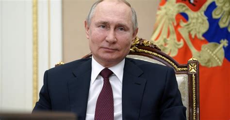 putin signs law allowing him to serve 2 more terms as russia s president cbs news