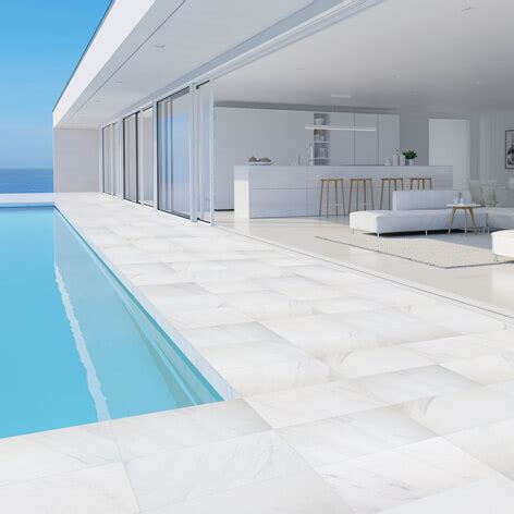 These pleasantly neutral porcelain pavers come in a finish that only adds to their charm. Carrara Marblano Porcelain Pool Tiles and Coping. Outdoor ...