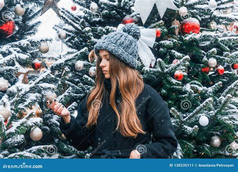 Beautiful Russian Girl In A Cloud Day In Winter Walking In Tverskaya Square In Christmas Time