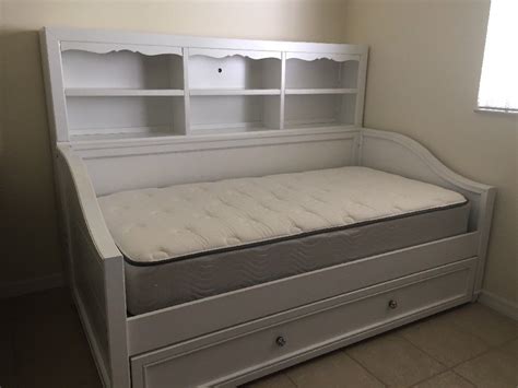 For extra comfort, you can add some padding to the trundle mattress once it is pulled. Wooden Daybed with Trundle and Bookcase in White. 2 Twin ...