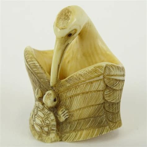 early 20th century japanese baisho shop carved netsuke in the form of a stork and turtle finely