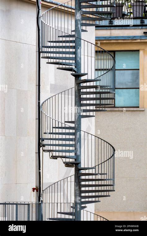 Exterior Metal Spiral Fire Escape Staircase Leading To Emergency Exits