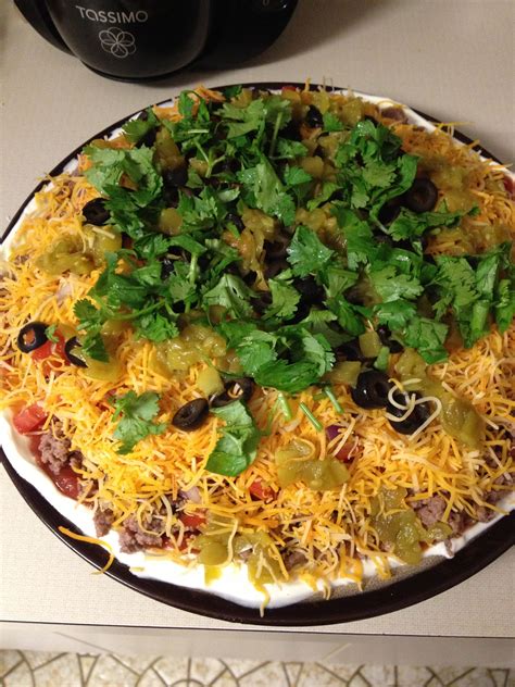 In a large mixing bowl, combine cream cheese, sour cream, and taco seasoning with a hand mixer until the dip is combined and creamy. Taco dip!! 9 layers of goodness! Sour cream, salsa, chop ...