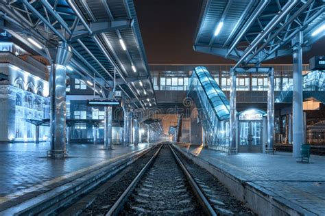 Railway Station At Night Train Platform In Fog Railroad Stock Photo