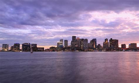 Boston Skyline At Sunset With Purple Sky And Ocean Stock Image Image