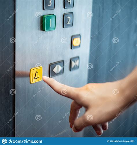 Male Hand Pressing On Emergency Button In Elevator Stock Photo Image