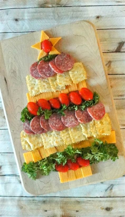Appetizers for christmas party needs to look cute on the plate as well. Amazing Holiday Cheese, Cracker and Sausage Christmas Tree ...