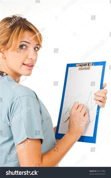 Beautiful Doctor Nurse Writing On Clipboard Stock Photo 58171084