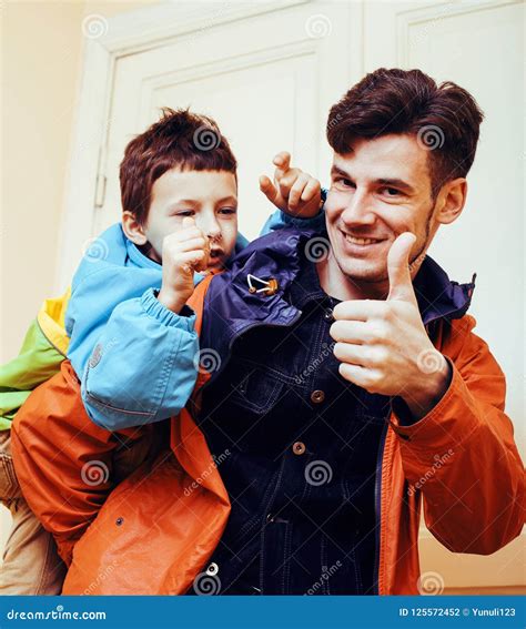 Young Handsome Father With His Son Fooling Around At Home Lifes Stock