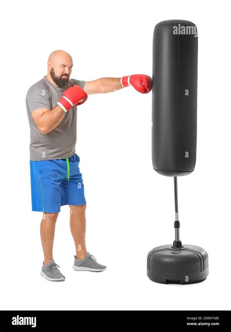 Overweight Man In Boxing Gloves Hitting Punching Bag On White
