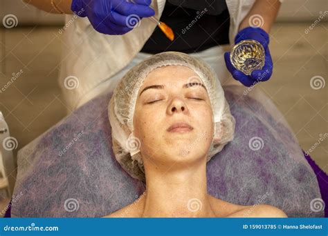 Beauty Clinicwoman Gets A Professional Facial Procedure Beautician Makes Massage On A Woman`s