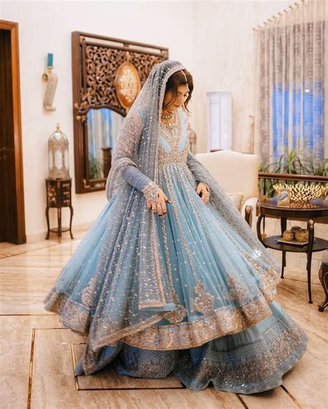 A Woman In A Blue Bridal Gown