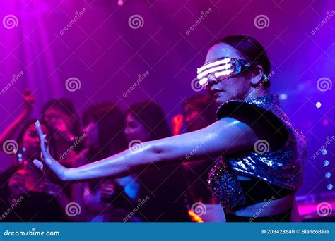 Techno Dancer In Night Club Dancing To The Beat Of Music From Dj Stock