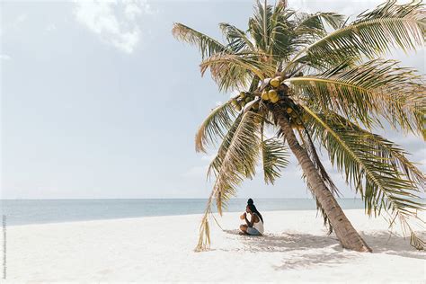 Woman Resting At The Beach By Stocksy Contributor Andrey Pavlov