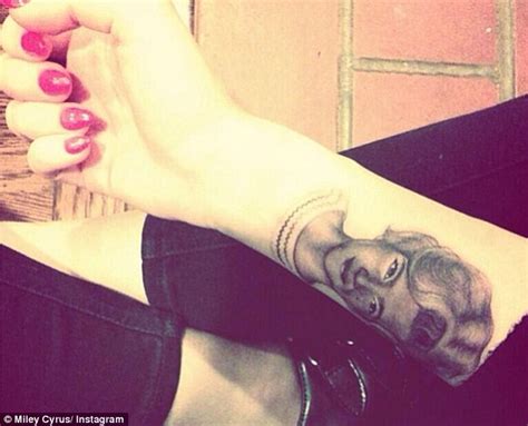 Miley Cyrus Gets Another Tattoo This Time A Portrait On Her