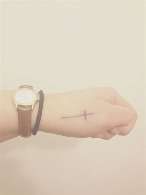 Silhouette cross tattoos on wrists. pretty + delicate cross tattoo on hand idea. | Cross ...