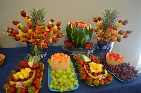 A Table Topped With Lots Of Different Types Of Fruits And Veggies On Trays