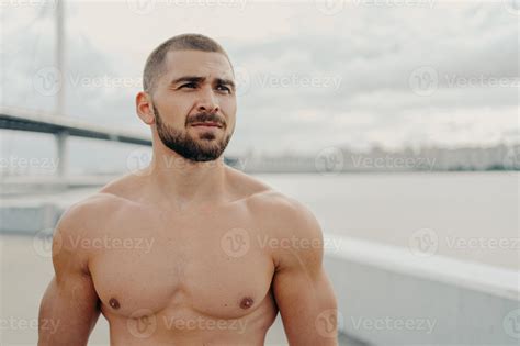 Horizontal Shot Of Muscular Man With Naked Torso Thick Beard Looks