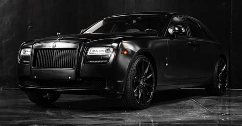 Luxury matte black car in modern studio · Free Stock Photo