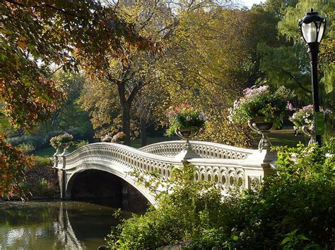 The bow bridge/ˈboʊ/ is a cast iron bridge located in central park, new york city, crossing over the lake and used as a pedestrian walkway. Bow Bridge Central Park Photograph by Patricia Caron