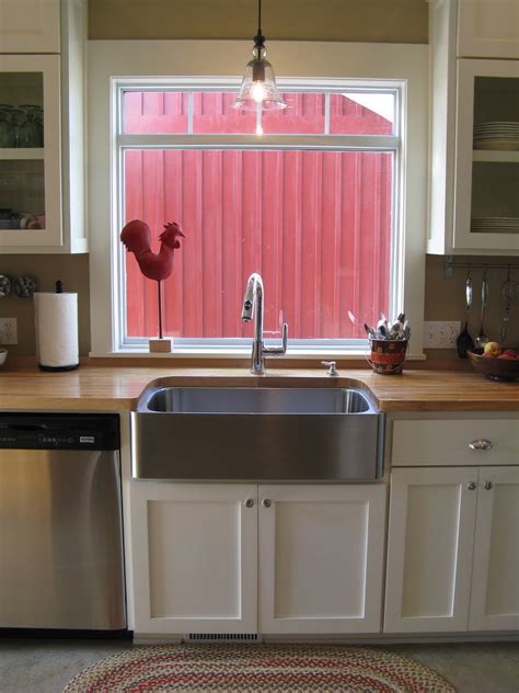If you're looking to add some flair to your outdoor kitchen, explore the option of stainless steel outdoor kitchen cabinets. Red Rooster & Bucket of Silverware
