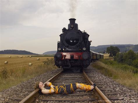 Image Detail For Woman Tied Up In Rope Lying On Train Track In Front