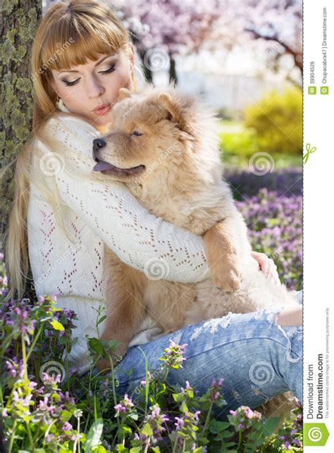 Portrait Of A Woman With Her Dog Outdoors Stock Photo Image Of Grass