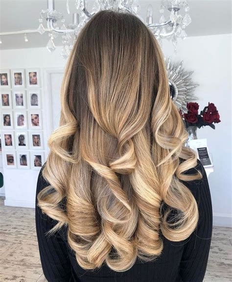 Beautiful Two Toned Blonde Hair With Dark Roots Styled With A Bouncy