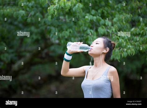 Women Drink Water After Exercising Stock Photo Alamy