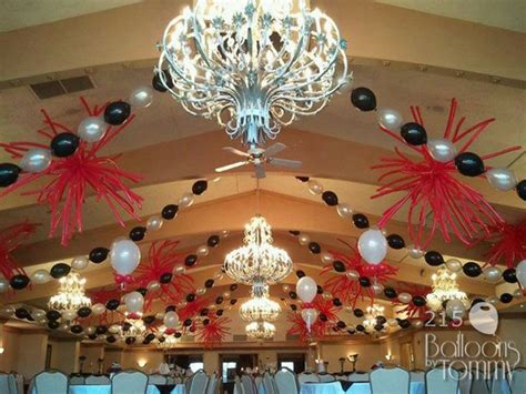 One of the latest trends this year has us looking up. Using the existing decor we used beaded swags of balloons ...