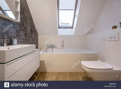 Attic Bathroom With Bathtub Window Toilet And Basin Stock Photo Alamy