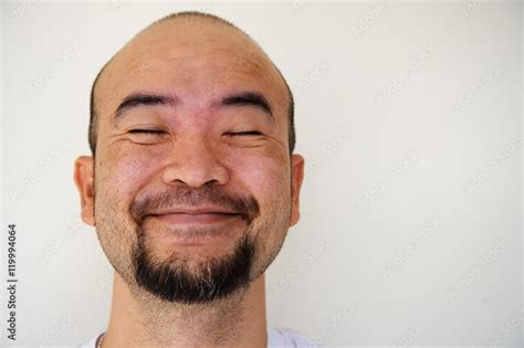 Happy Smiling Beard Bald Asia Man On White Background Stock Photo